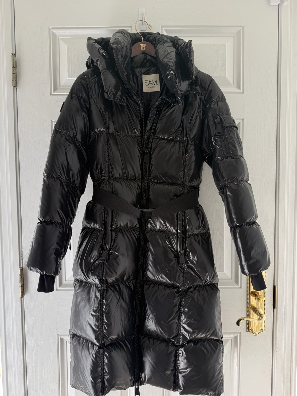 SAM. Glossy Black Long Quilted Belted Puffer with Hood